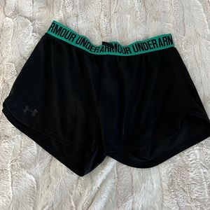 Black under armour athletic shorts with green accents